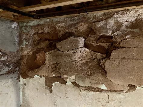 How do I self-repair a section of crumbling basement wall, or should I hire a professional ...