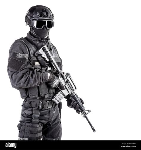 Spec ops police officer SWAT in black uniform and face mask Stock Photo ...