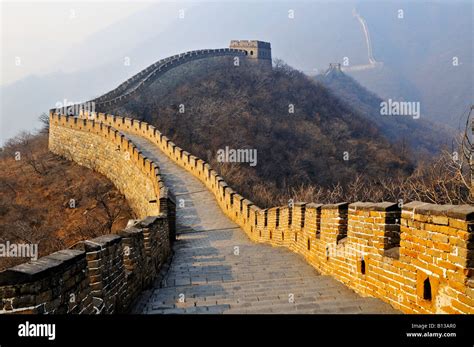 Great Wall of China with several watchtowers visible in golden late ...