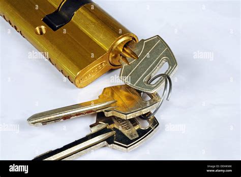 Barrel lock and keys against a white background Stock Photo - Alamy