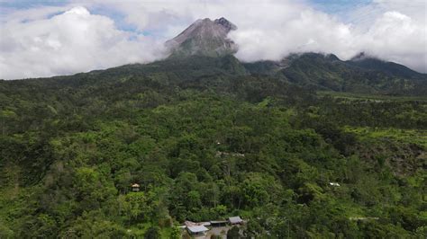 Aerial view of active Merapi mountain with clear sky in Indonesia 7412534 Stock Video at Vecteezy