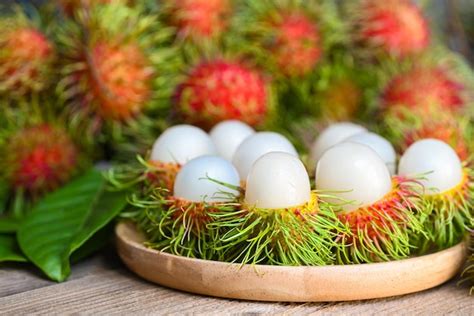 Premium Photo | Fresh and ripe rambutan sweet tropical fruit peeled ...