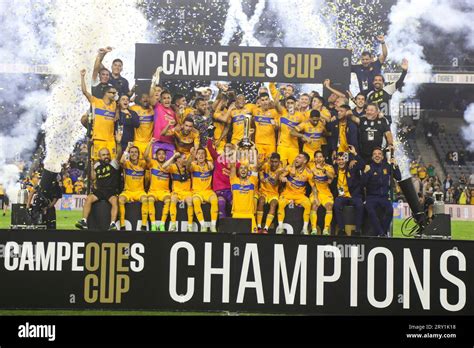 Tigres UANL players celebrate with the trophy after their win during ...