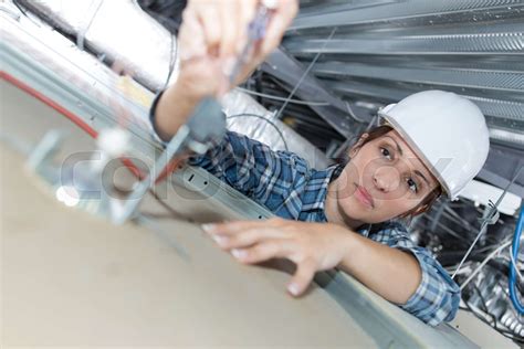 installing smoke detector | Stock image | Colourbox