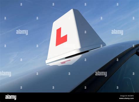 British driving school car roof sign Stock Photo - Alamy