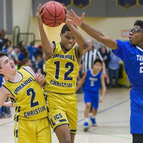 The Varsity boys basketball team battles Trinity Christian during their ...