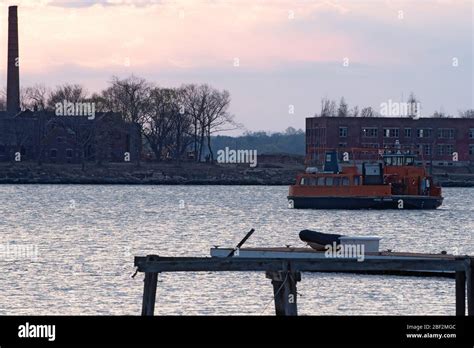 NEW YORK, NY - APRIL 16: Ferry carrying Special Operation Medical Examiner refrigerated truck ...