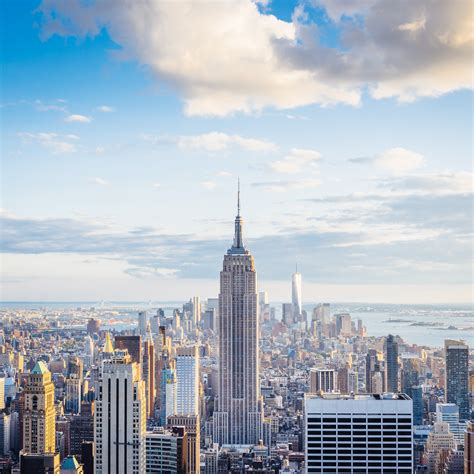 an aerial view of new york city with the empire building in the foreground and other tall buildings