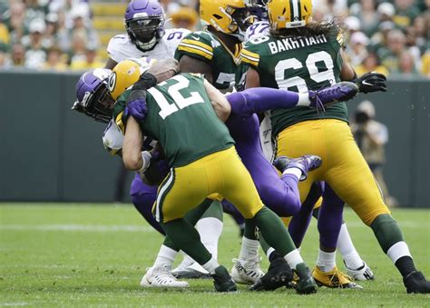 Minnesota Vikings’ Danielle Hunter sacks Green Bay Packers’ Aaron Rodgers during the second hal ...