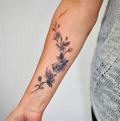 20 Beautiful Wrist Tattoo Ideas | Flower wrist tattoos, Vine tattoos, Purple flower tattoos