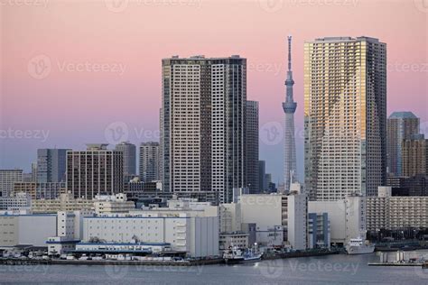 Tokyo skyline during sunset seen from the water 18932527 Stock Photo at ...