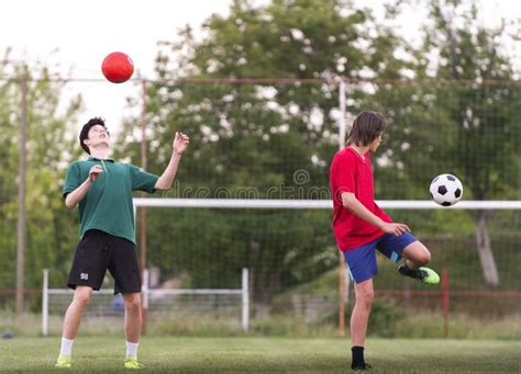 Teenagers Playing Football on Field Stock Image - Image of playing, teenagers: 182546493