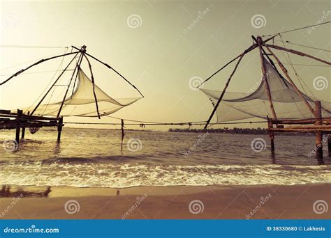 Sunset at Tropical Beach with Chinese Fishing Nets Stock Photo - Image ...