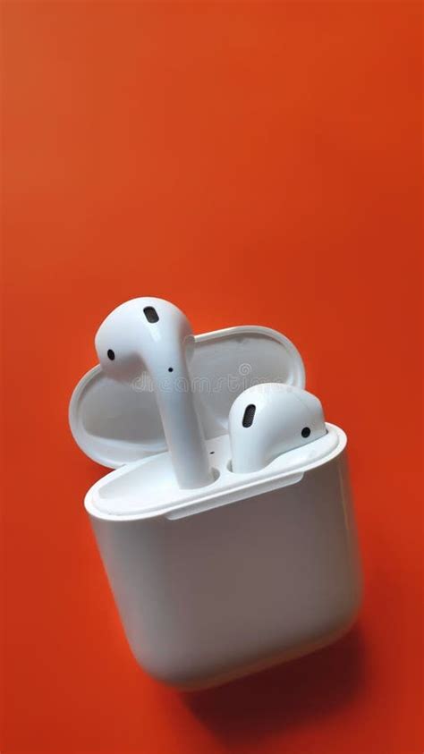 White Apple Airpods, in Orange Background, Airpods with Case in a ...