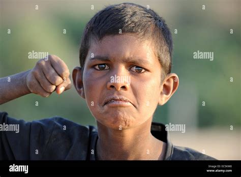 Funny indian boy give punch Stock Photo - Alamy