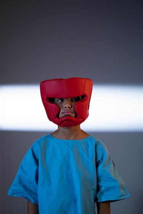 Child Wearing a Boxing Headgear · Free Stock Photo