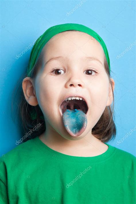 Girl with tongue, painted in blue color Stock Photo by ©RadaRani 128185886