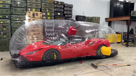 Watch A YouTuber Throw Ladders And Stuff At A Ferrari Parked In A Plastic Storage Bubble - The ...