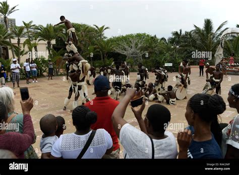 Durban, KwaZulu-Natal, traditional Zulu culture dancing troupe entertaining tourists at Ushaka ...