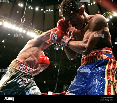 Bobby Pacquiao, of the Philippines, braces for a punch from Humberto Soto, of Mexico, during the ...