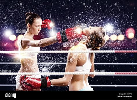 Two women boxing in ring Stock Photo - Alamy