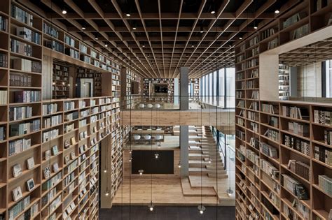 beijing fenghemuchen space design builds yue library as wooden forest of books in hangzhou