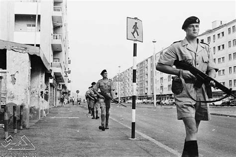 British soldiers on foot patrol in the al-Mualla district of Aden during the Aden Emergency in ...