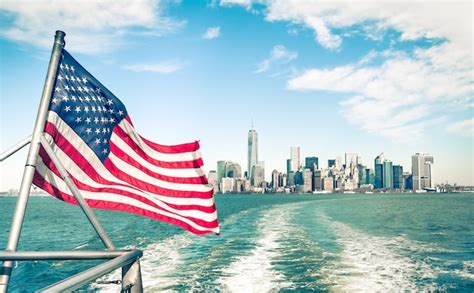 Premium Photo | New york and manhattan skyline from hudson river with american flag