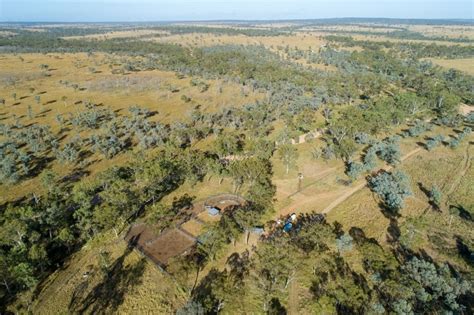 Image of Aerial view of farm and cattle yards. - Austockphoto