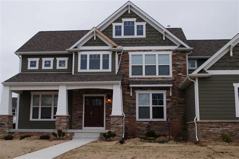 Vinyl Siding and Stone Combination | We like the dark gray on this post ...