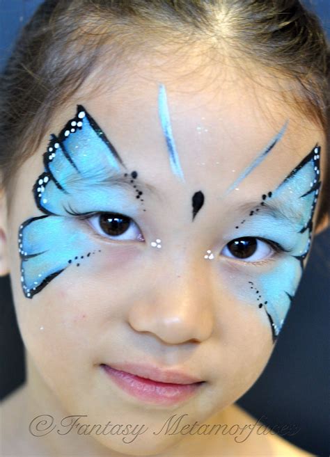 Simple blue butterfly face painting | Butterfly face paint, Princess face painting, Butterfly face