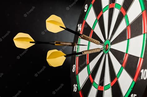 Premium Photo | Closeup of darts in bullseye