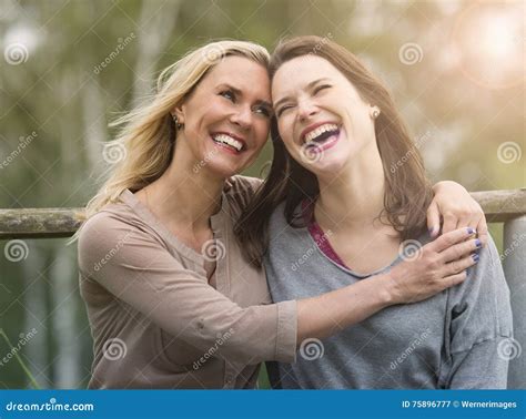 Two Woman Laughing and Hugging Each Other Outdoors Stock Image - Image of affectionate, daughter ...