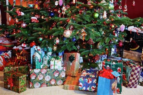 A Christmas Tree With Gifts Underneath It - Stock Photo - Dissolve