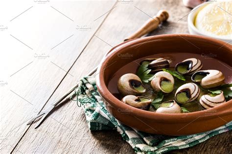 Ad: Escargots de Bourgogne by etorres69 on @creativemarket. Escargots de Bourgogne. Snails with ...