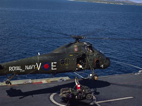 Westland Wessex HU5 XT469 of 848 NAS aboard HMS Bulwark (R08) prepares to lift a Land Rover ...