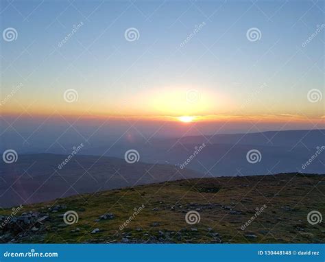 Mountain top sunrise stock photo. Image of looking, sunset - 130448148