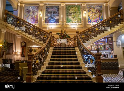 Pointillism paintings hang at top of staircase in Inverness Art Museum ...