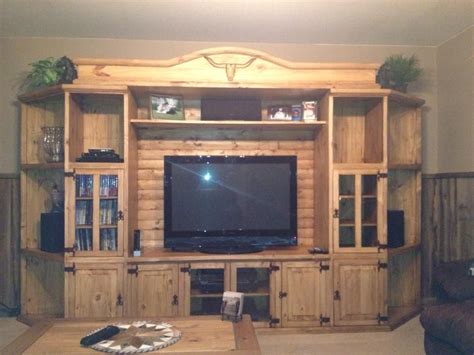 Rustic pine Entertainment center with long horn carvings | Rustic entertainment center ...