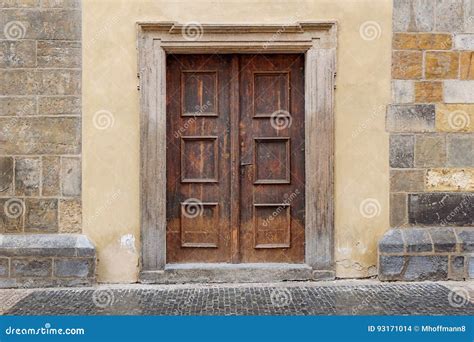 A Wooden Double Door with Rectangle Door Frame in a Stone Wall Stock Photo - Image of ...