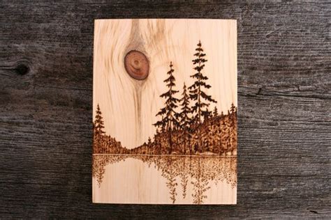 This beautiful lakeside scene has been burnt into a piece of salvaged ...