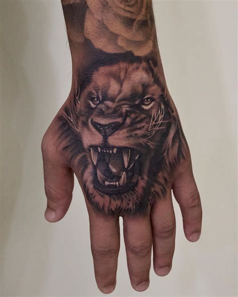 how much does a lion hand tattoo cost - Livia Carman