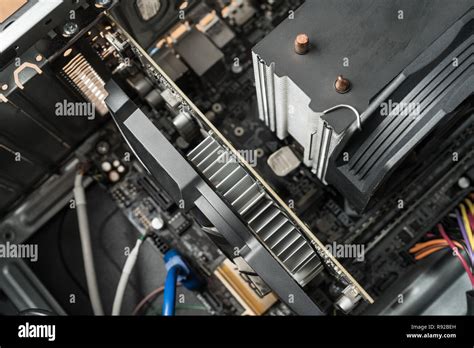 Closeup on pc computer internal parts. Graphics card and cpu processor heat sink Stock Photo - Alamy