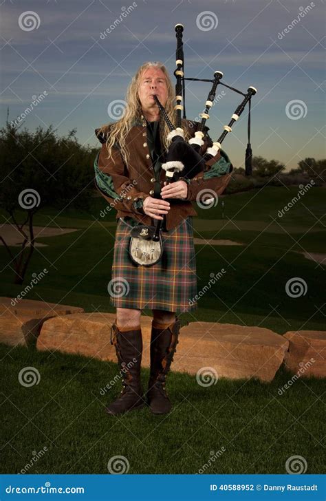 Man Plays Scottish Bagpipes at Dusk Editorial Photography - Image of ...