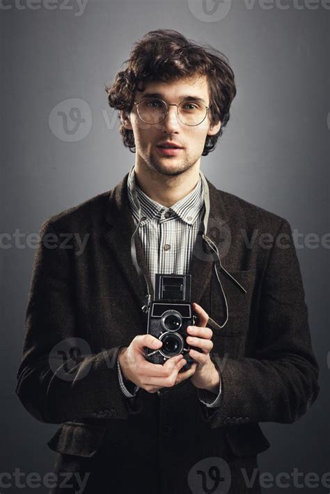 Man with vintage camera 9367269 Stock Photo at Vecteezy