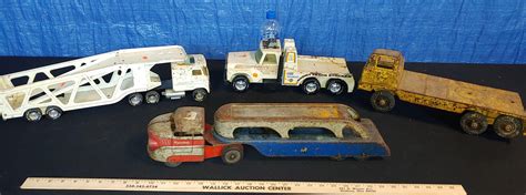 Lot - (3) Nylint metal trucks (all rough/rusty), Wyandotte hauler (rusty/rough)