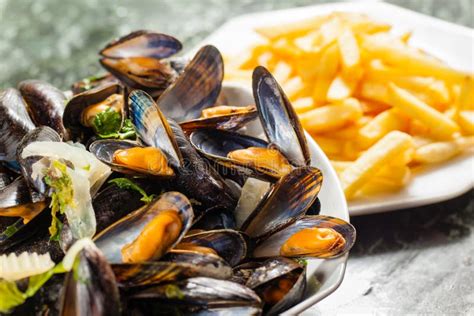 Mussels and french fries stock image. Image of food, close - 62747521