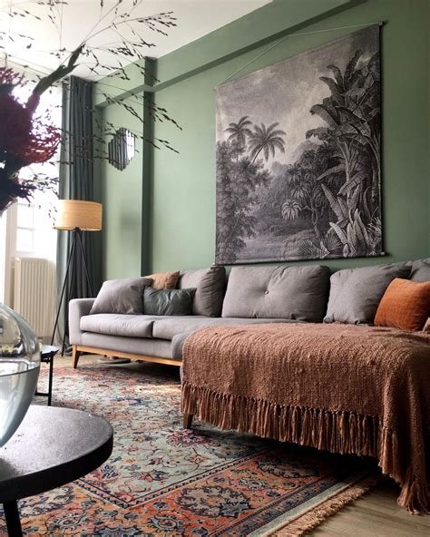 Gray tapestry over a gray sofa, green walls & a beautiful green & clay ...