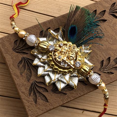 Glowing Gold Radha Krishna Rakhi Band for Brother | Buy Online Fancy Rakhi