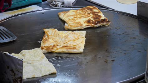 Roti Making, Roti fried on frying pan, Indian traditional street food ...